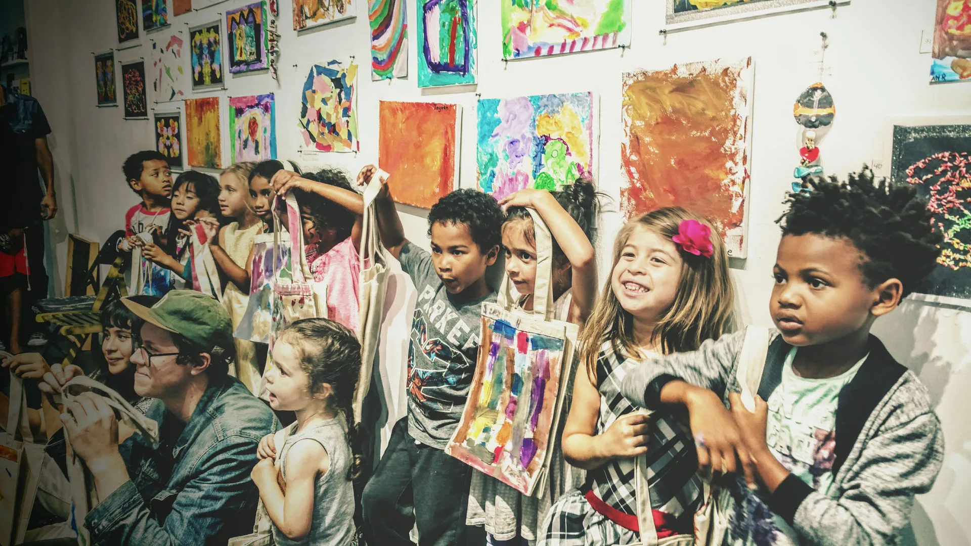 Students showcasing artwork at gallery