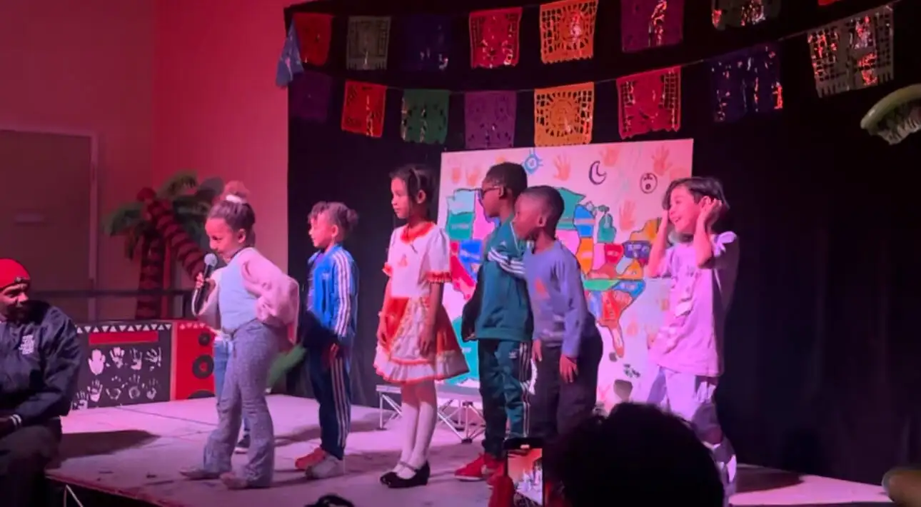 A student singing at the Latino Heritage showcase