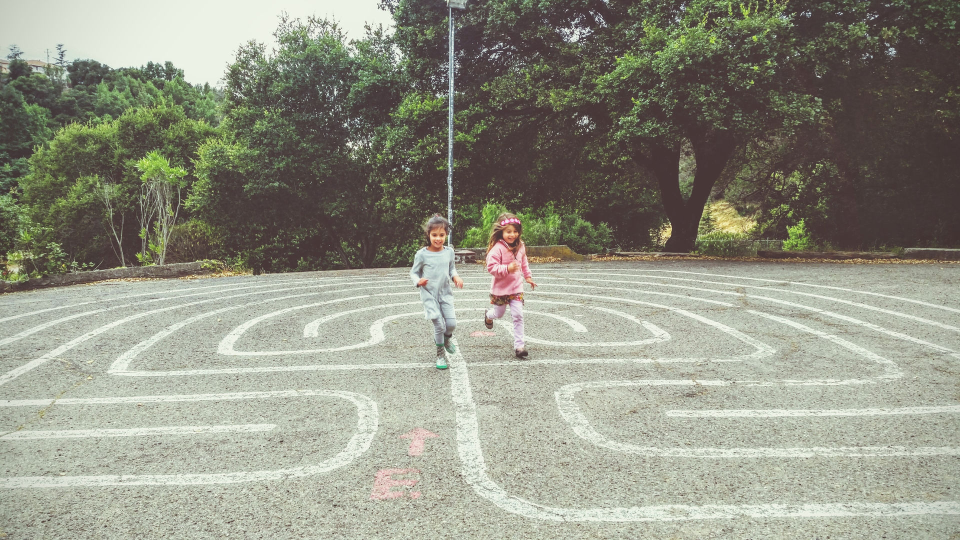 Pear Tree students running on outdoor labyrinth