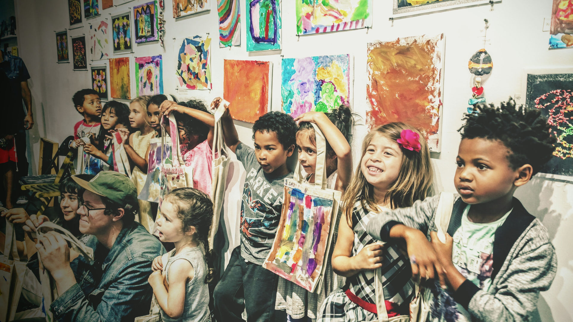 Students showcasing artwork at gallery